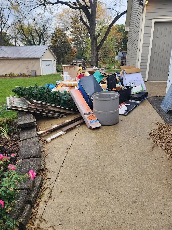 Dumpster being loaded with debris for 3 Yard Dumpster Rental in Brodhead